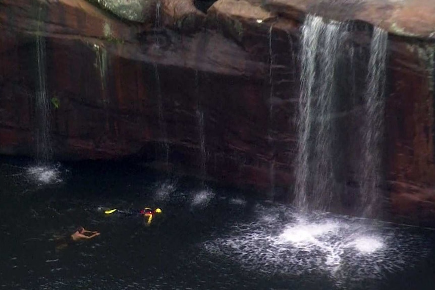 A diver searches for the body of a man who drowned at Wattamolla in the Royal National Park.