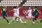 USA striker Alex Morgan dribbles towards Matildas captain Sam Kerr. 