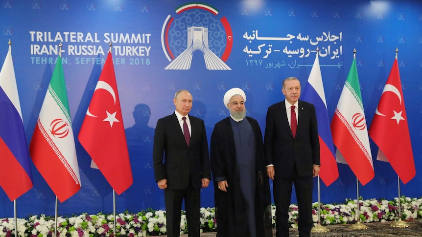 Putin, Rouhani and Erdogan pose for a photo at the trilateral summit on Syria.