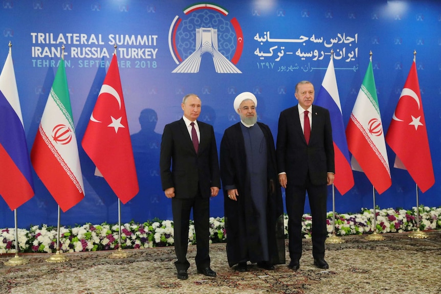 Putin, Rouhani and Erdogan pose for a photo at the trilateral summit on Syria.