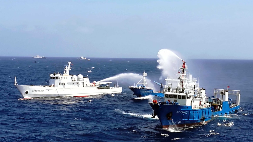 Chinese ships conduct an emergency drill in the South China Sea.