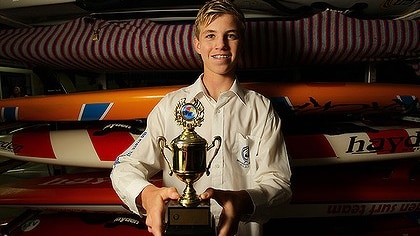 Surf lifesaver Matt Barclay holding a trophy.