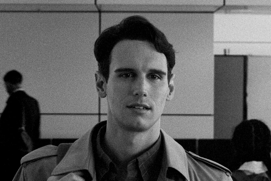 Black and white close-up still of Cory Michael Smith in 2018 film 1985.