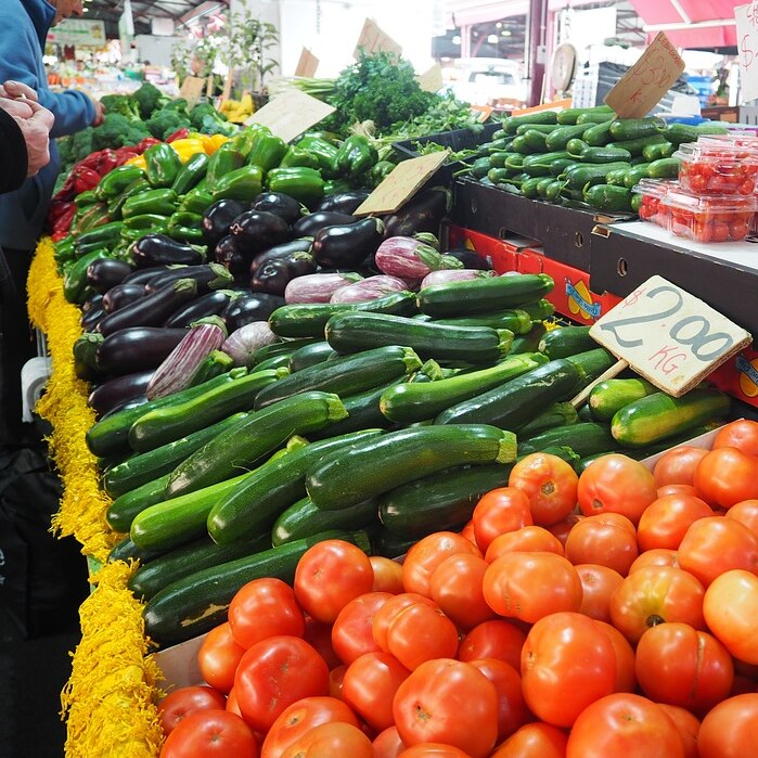 Photo of various vegtables at a stall at a market
