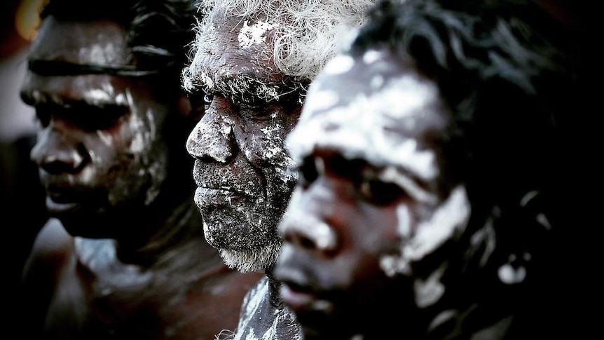 Aboriginal dancers with white pain on their faces