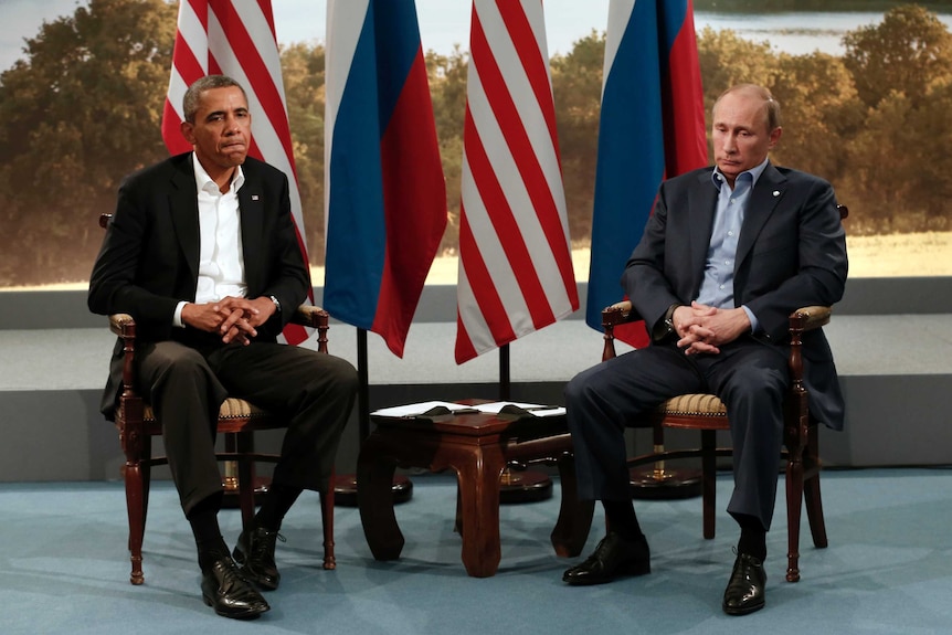 Mr Obama and Russian President Vladimir Putin not speaking during media event