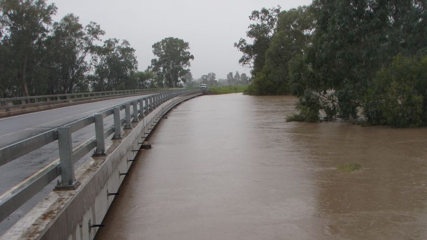 Highway bridge alongside a swollen river near Theodore, in central Queensland, west of Bundaberg