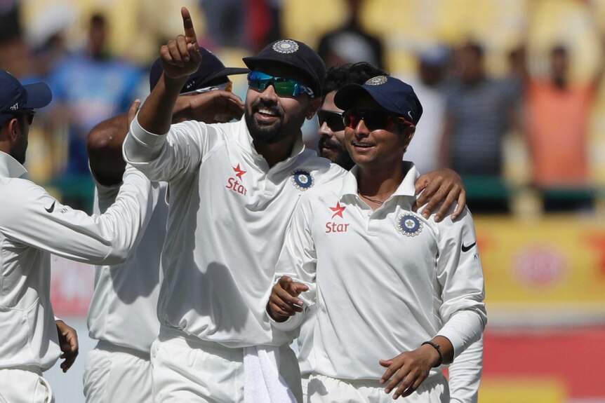 Vijay and Kuldeep celebrate an Australian dismissal