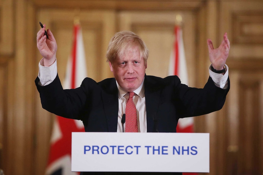 British Prime Minister Boris Johnson gestures during a speech.