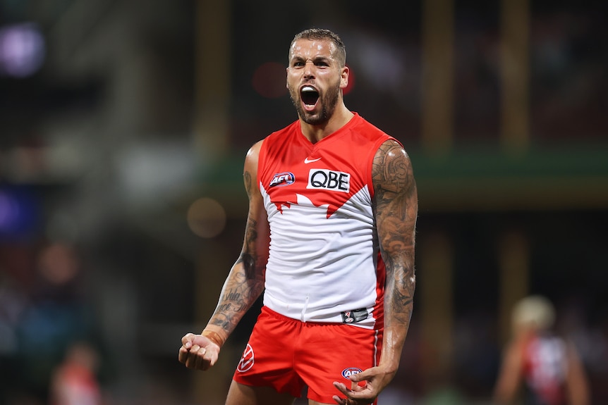 Lance Franklin clenches his fists and shouts in celebration