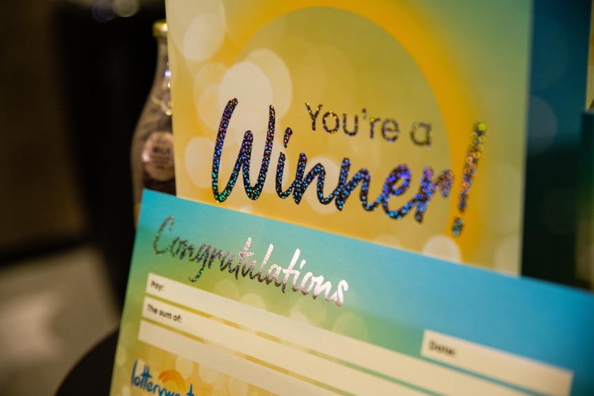 A card that says 'you're a winner'.