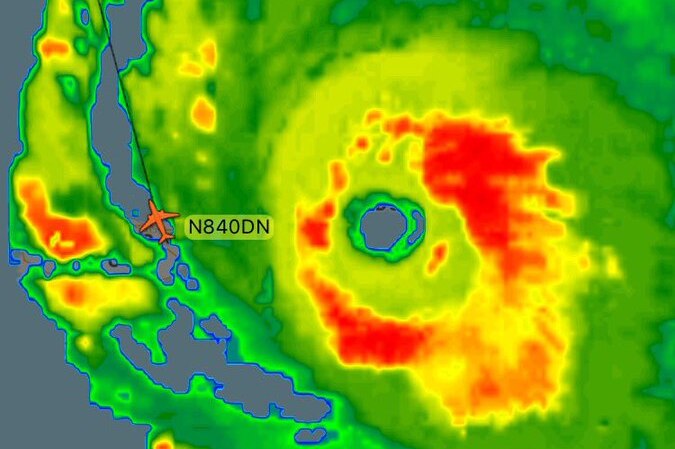 A screenshot of a flight radar shows a flight path against the satellite image of Hurricane Irma.