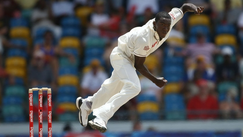 West Indies Jerome Taylor mid bowl to Australia