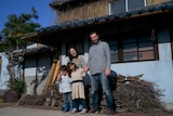 David Stuart, Junko, Juna and Remy outside their new home on a Japanese island