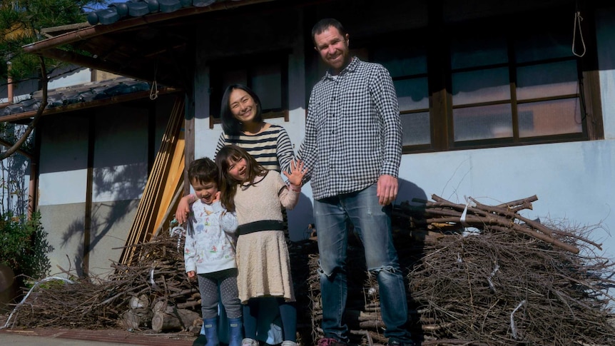David Stuart, Junko, Juna and Remy outside their new home on a Japanese island