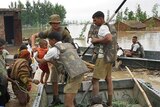 Indian troops assist people stranded by flood