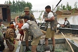 Indian troops assist people stranded by floods