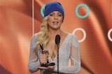 Host of Channel Ten's The Project, Carrie Bickmore, accepting the 2015 Gold Logie trophy.