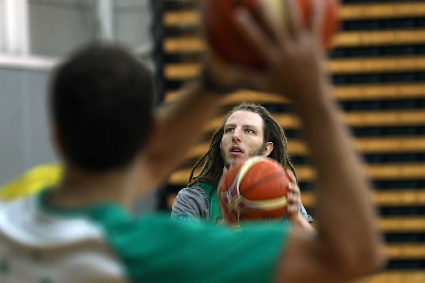 Craig Moller prepares to take a shot at the basket at a Boomers training session.