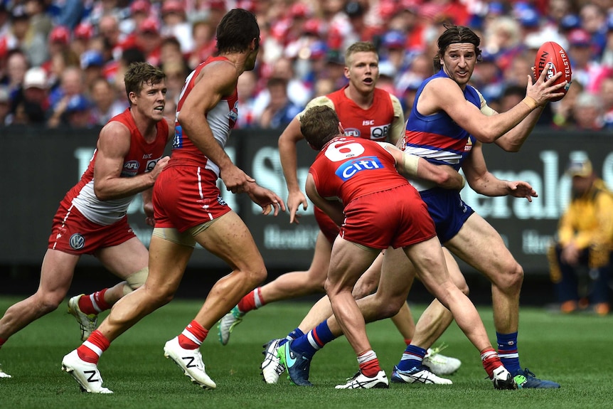 The Bulldogs' Marcus Bontempelli (R) in action during the 32016 AFL grand final against Sydney.