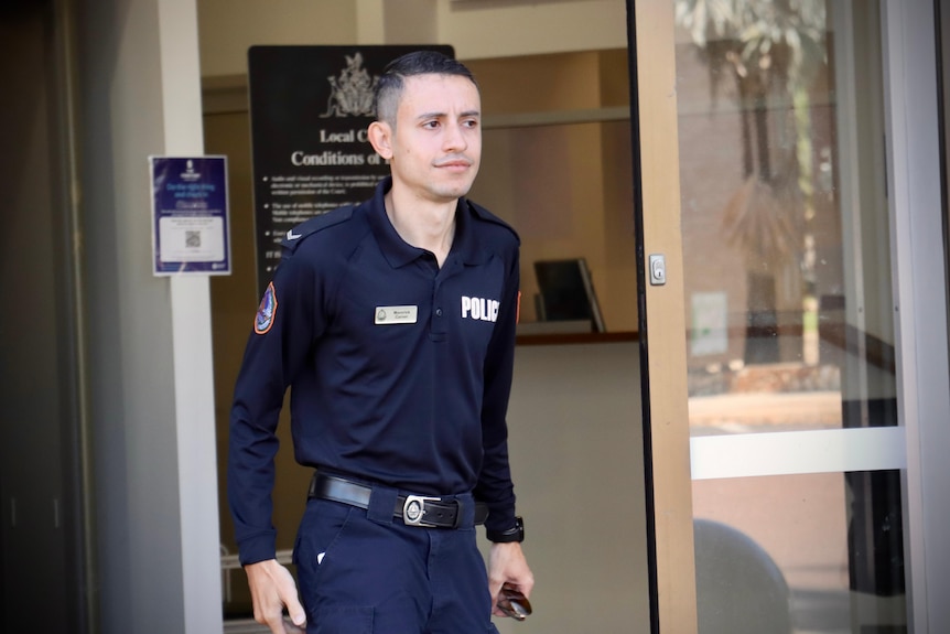 NT Police Constable Maverick Carver walking out the doors of the Darwin Local Court.