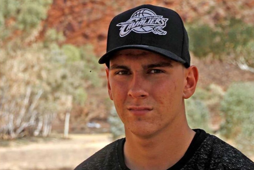 Dylan Voller wearing a baseball cap.