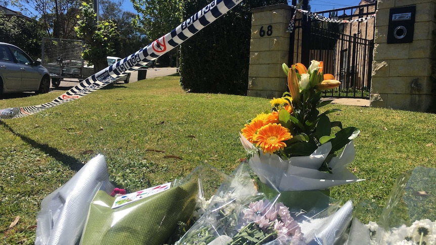 Floral tributes laid at Davidson house to remember a family who are believed to have died in a murder-suicide.