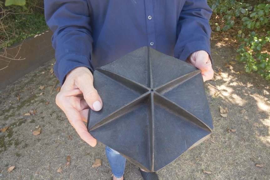 a black plastic hexagon 