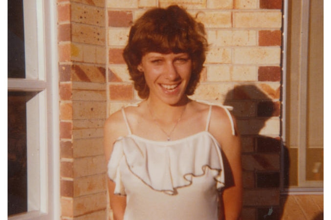 Indigenous poet Ali Cobby Eckermann, aged 17, smiles as she poses for a photo against a brick wall