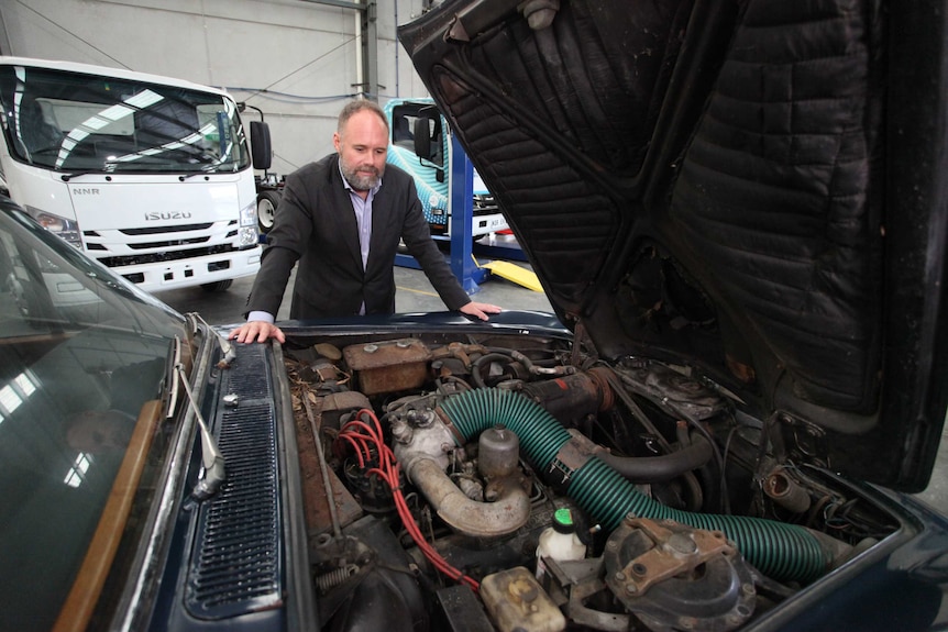 Tony Fairweather inspects the engine bay on the 1971 Rolls-Royce Silver Shadow.