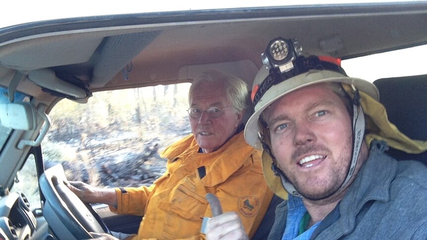 Rowan and Wally Peart snap a photo in the car while wearing their firefighting gear