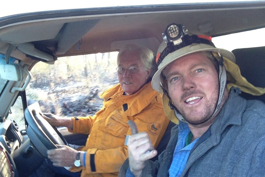 Rowan and Wally Peart snap a photo in the car while wearing their firefighting gear