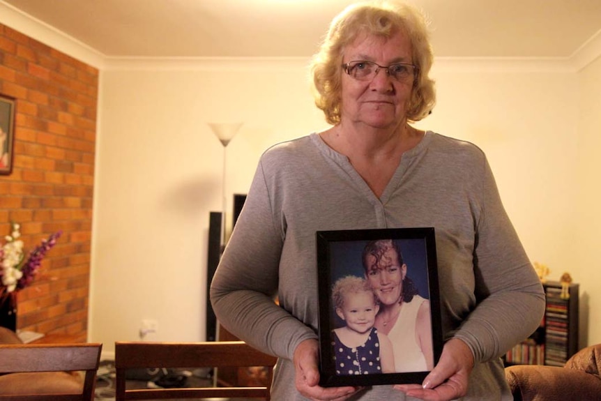 Brenda Martin, Heather's mother, with a photo of her daughter and granddaughter.