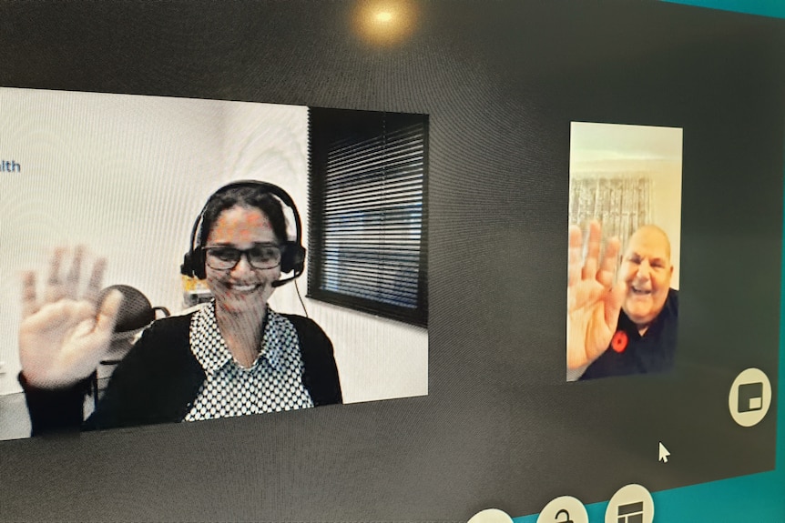 A screen showing a woman, a health professional, doing a telehealth consult with a man who is also on screen.