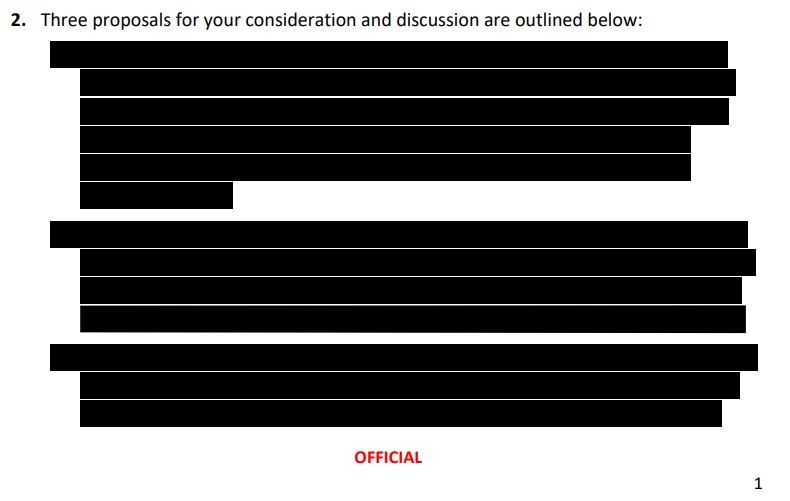 A section of an official document showing one line of text, then three paragraphs covered by black bars.