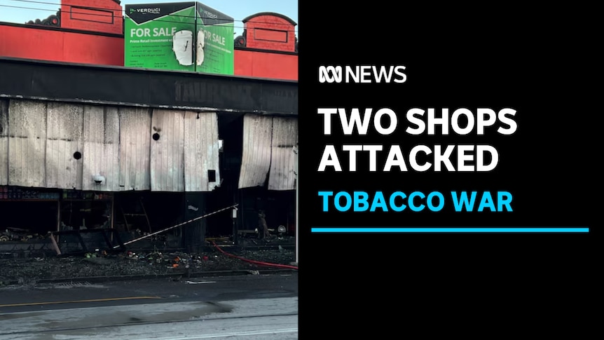 Two shops attached, tobacco war: A dark image at night of a burnout shop. 
