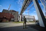 A Russian stands guard at the Zaporizhzhia nuclear plant in southern Ukraine