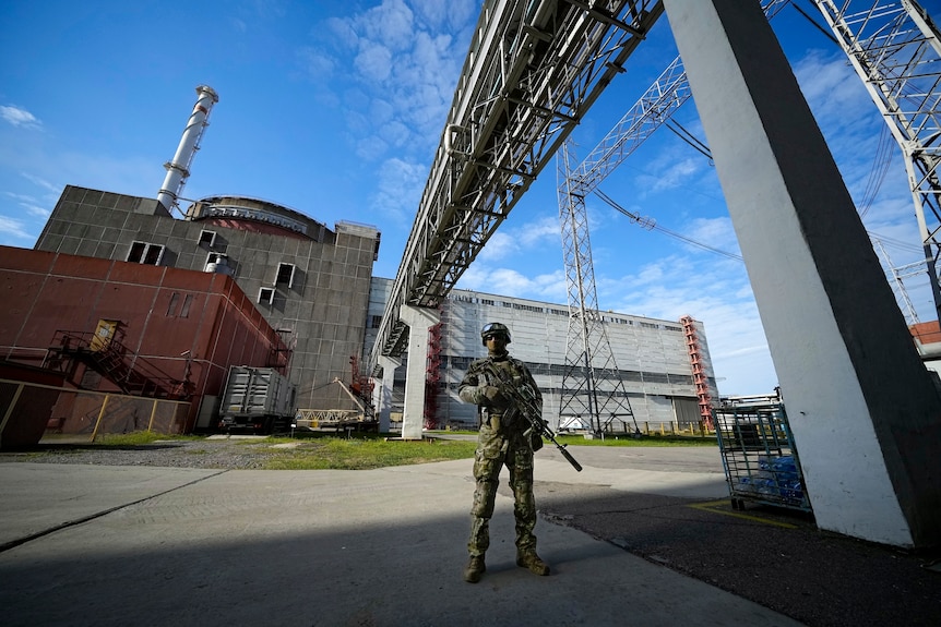 A Russian serviceman stands guard in an area of the Zaporizhzhia Nuclear Power Station.