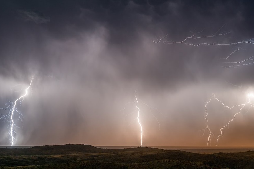 A wide shot of lightening and a storm 