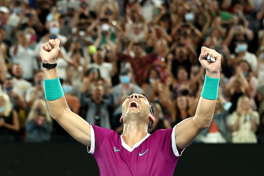 Tennis player Rafael Nadal clenches both fists and shouts to the sky after winning the Australian Open final.
