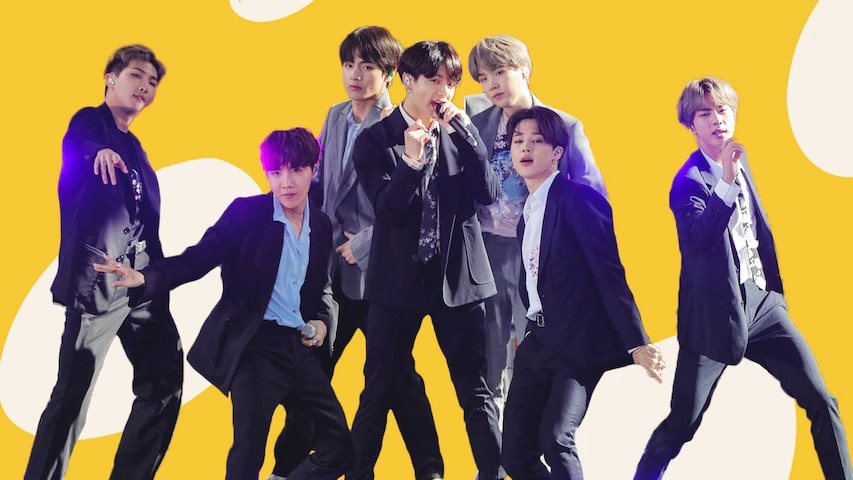 South Korean supergroup BTS appear in front of a yellow background