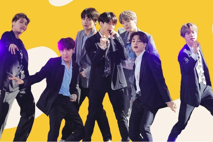 South Korean supergroup BTS appear in front of a yellow background