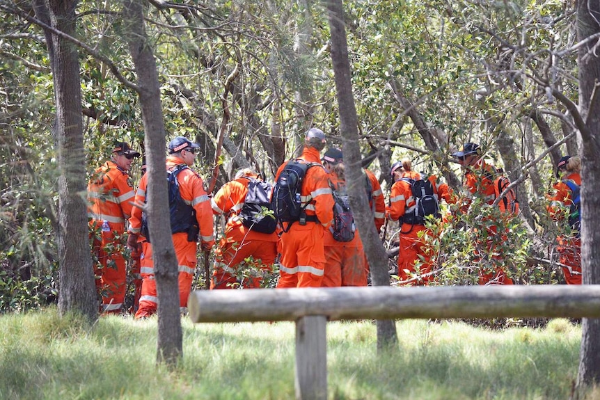SES workers help police conduct a land and water search at Deep Water Bend in Bald Hills in Brisbane's north