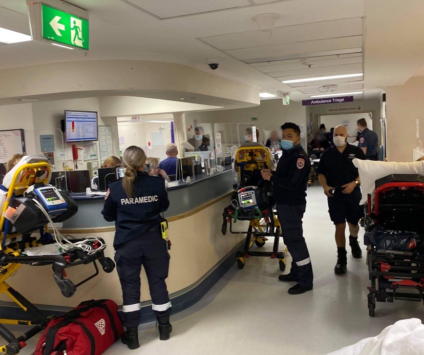 Paramedics and patients inside a hospital.