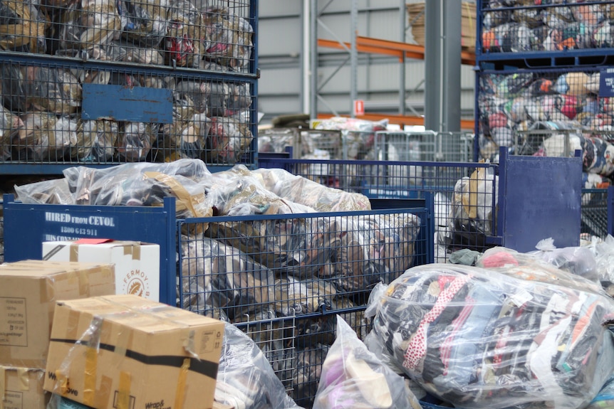 A warehouse full of clothes and other donations.