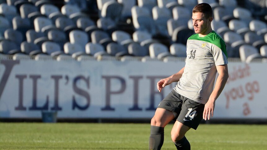 James Troisi passes the ball at Socceroos World Cup camp