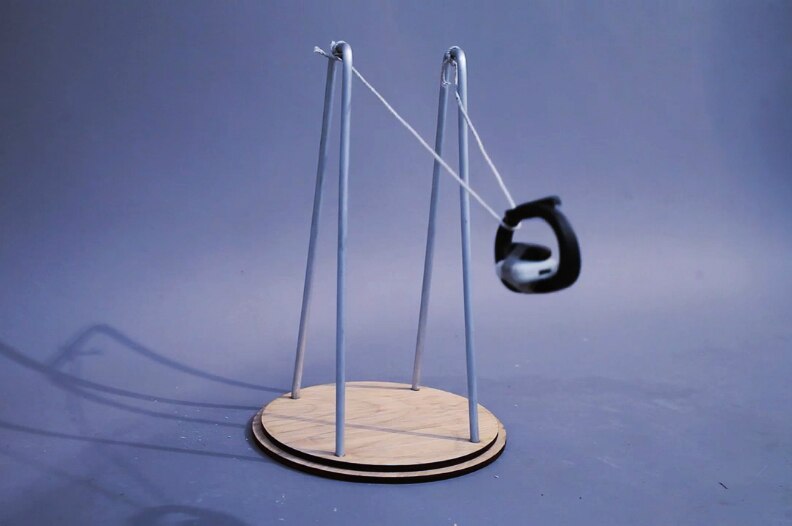 A fitness tracker strapped to a pendulum.