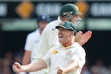 David Warner reacts to the dismissal of England's Matt Prior on day four at the Gabba.