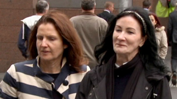Rebecca Taylor, right, leaves an IBAC hearing in Melbourne with an unidentified woman.