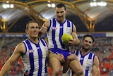 Brent Harvey chaired off after breaking North Melbourne's games record